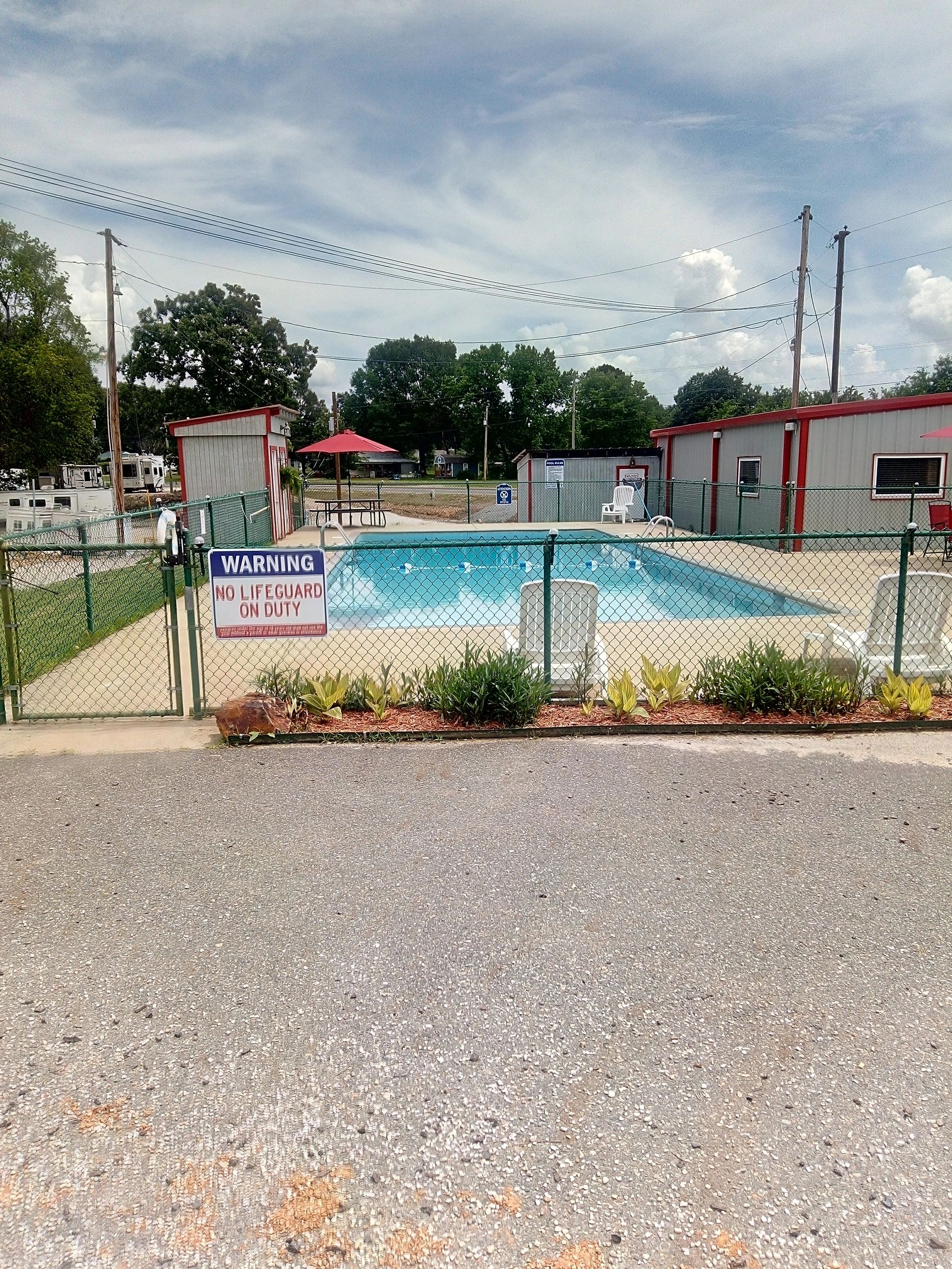 Outdoor pool area pictured at Caddo Valley RV Park